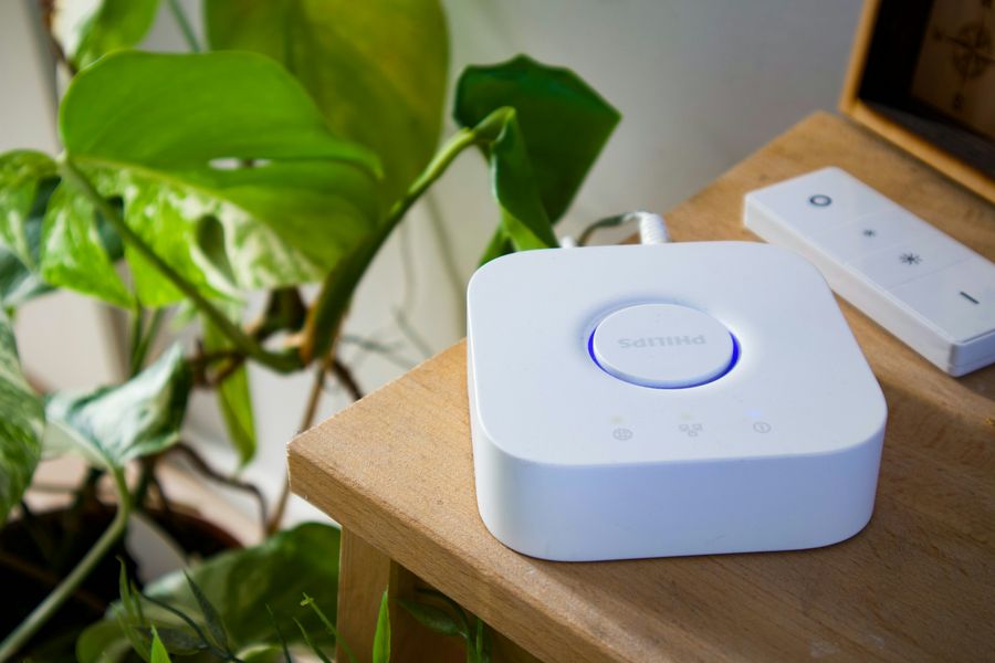 Smart lighting hub and dimmer remote on a shelf